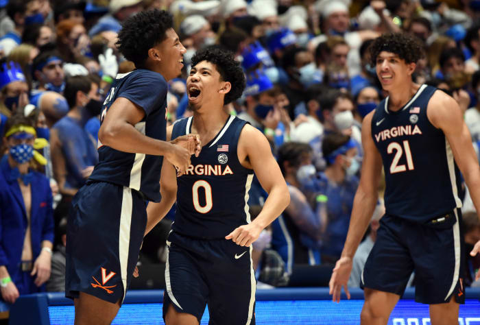 #0 Kihei Clark celebrates with teammates #2 Reece Beekman and #21 Kadin Shedrick